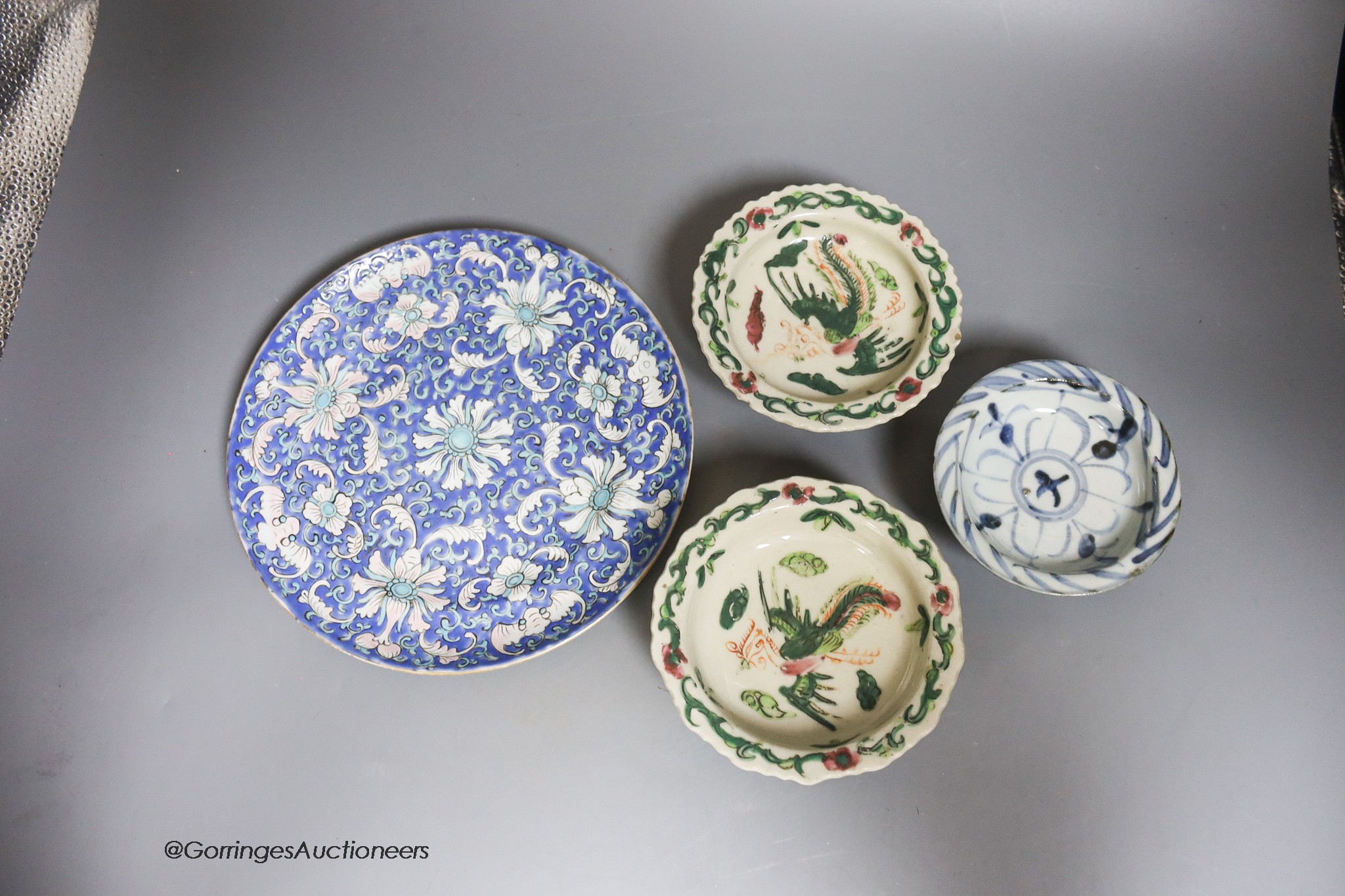 A pair of Chinese stem dishes, a blue-and-white stem dish and a 19th-century Chinese enamelled dish, diameter 21cm